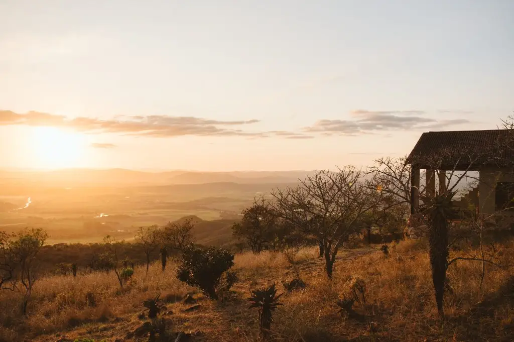 Hilltop lodge overlooking the valley at sunset